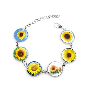 Silver sunflower bracelet featuring six glass charm pendants with floral designs