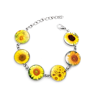 Silver sunflower glass cabochon bracelet with adjustable chain on white background