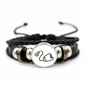 Detail of multi-layer leather bracelet with glass stethoscope pendant and silver beads