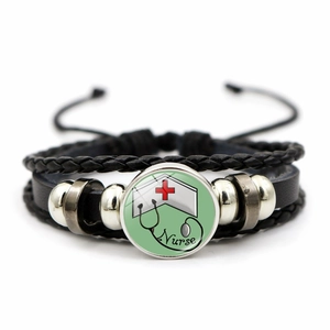 Detail of multi-layer leather bracelet with glass cabochon featuring nurse and stethoscope