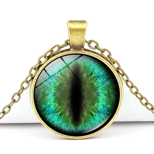 Vintage bronze dragon eye necklace with a detailed green iris glass cabochon pendant