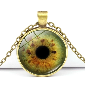 Vintage bronze dragon eye necklace with green glass pendant and retro metal chain links