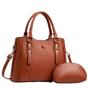 Brown large capacity tote bag with vertical textured leather and matching small purse