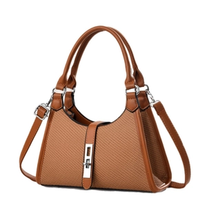 Brown woven texture tote bag with leather trim and adjustable shoulder strap