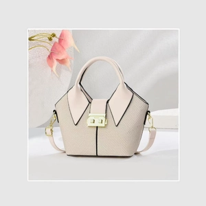 Beige woven bucket handbag with pink leather trim and gold buckle clasp for women