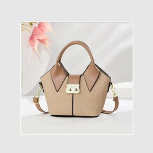 Minimalist woven bucket bag with brown leather trim and golden square buckle lock