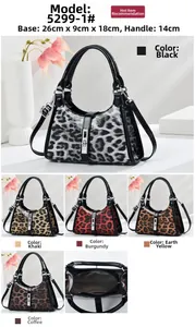 Macro view of leopard print texture and high-quality metal hardware on shoulder bags