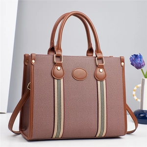 Sac fourre-tout élégant en toile marron avec garniture en cuir et sangle à rayures