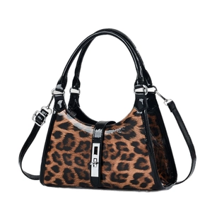 Chic leopard print crescent shoulder bag with glossy black trim and silver buckle hardware