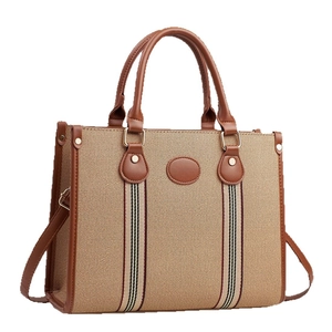 Sac fourre-tout vintage en tissu beige avec bordure en cuir marron et sangles rayées