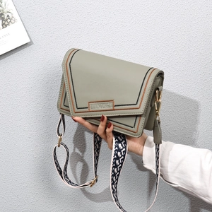 Fashionable pea green square crossbody bag with contrast stitching and woven strap