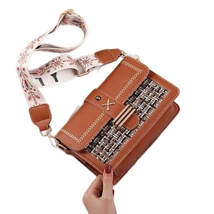 Brown canvas contrast handbag with woven panel and decorative jacquard strap