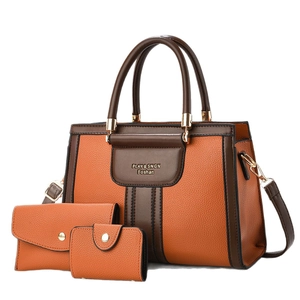 Orange and brown 3-piece tote bag set with textured leather and adjustable strap