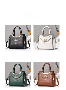 Detail view of retro patchwork handbags in black, white, green and brown leather textures