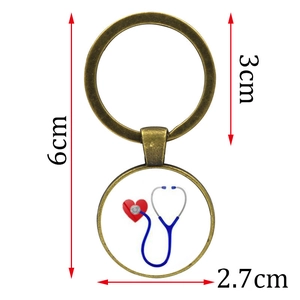 Antique bronze nurse keychain with stethoscope heart pendant and 6cm total length detail