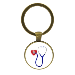 Detailed view of medical keychain featuring heart-shaped stethoscope and bronze finish