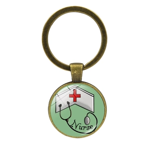 Detailed bronze nurse keychain featuring a green logo with a stethoscope and red cross