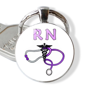 Detail of metal RN keychain with purple stethoscope and medical caduceus logo design