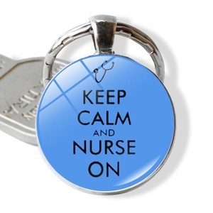 Close-up of nurse keychain with Keep Calm and Nurse On quote and stethoscope icon