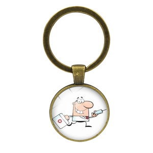 Detail of bronze medical keychain featuring a cartoon nurse with syringe and first aid kit