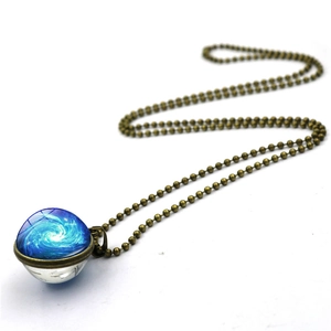 Cosmos space nebula glass ball necklace with blue swirl pendant and bronze bead chain