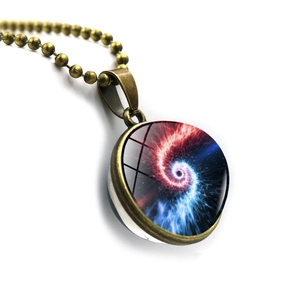 Close-up of a bronze cosmic space nebula pendant with a double-sided glass ball design
