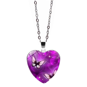 Blue butterfly heart pendant necklace with silver metal chain on a white background