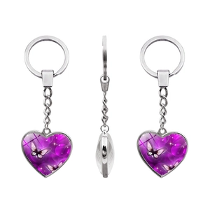 Three-view display of heart-shaped butterfly glass cabochon keychain with purple pattern