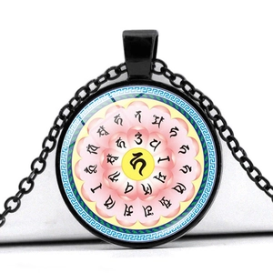 Detail of Shurangama Mantra time gem necklace featuring a pink lotus and Sanskrit symbols