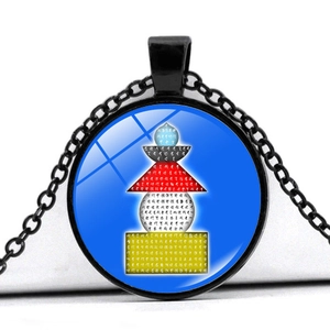 Detailed close-up of a black metal round pendant featuring five-element Stupa art and symbols