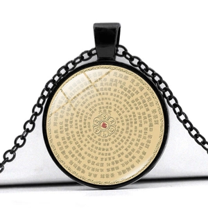Close-up of circular Buddhist pendant with Shurangama Mantra on black alloy chain