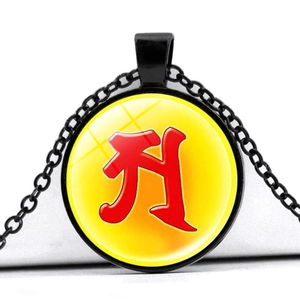 Minimalist black round pendant necklace with yellow glass cabochon and red character
