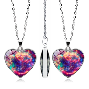 Symmetric view of silver heart pendant featuring a colorful nebula glass cabochon