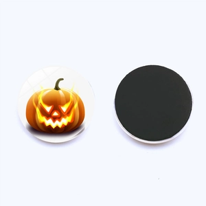 Detailed front and back view of a 25mm round Halloween pumpkin glass fridge magnet