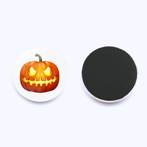 Detail view showing the front pumpkin pattern and full magnetic back of this 25mm magnet
