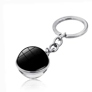 Silver metal keychain with 7.9cm double-sided black glass ball pendant on white background