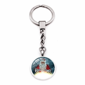 Detailed view of silver metal keychain featuring a round Santa Claus charm pendant