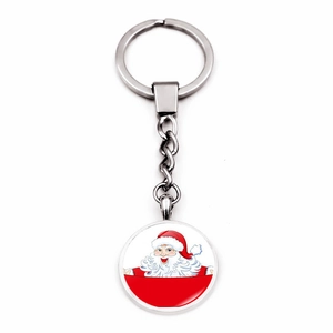 Detail of Christmas keychain with Santa Claus glass cabochon pendant and silver keyring