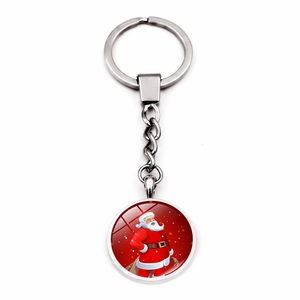 Detailed view of silver alloy keychain with glass cabochon featuring a Santa Claus pattern