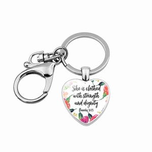 Detail view of heart pendant keychain with Proverbs 31:25 verse and floral design