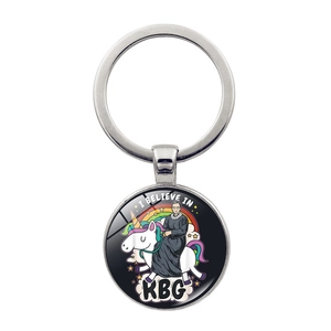 Detail of metal keychain featuring cartoon Ruth Bader Ginsburg on a unicorn with rainbow