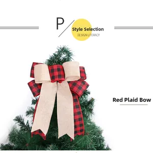 Detail of red plaid and burlap Christmas tree topper bow with rustic long ribbons