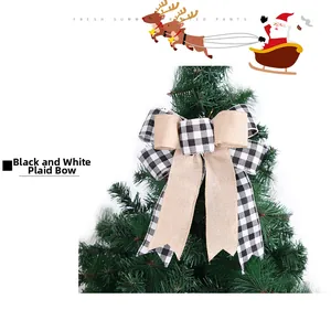 Detailed view of large black and white plaid bow decoration on a Christmas tree