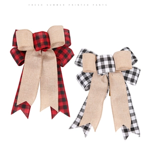 Detail of large buffalo plaid and burlap bows for Christmas tree and wall decoration