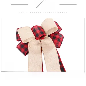 Detail of red and black plaid bow mixed with beige linen ribbon for Christmas decor