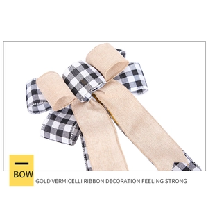 Detail of checkered and linen fabric bow ornament for Christmas tree decoration