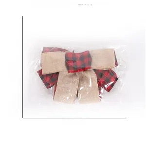 Detail of red and black buffalo plaid and burlap Christmas bow showing 23cm x 17cm dimensions