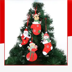 Detail of assorted fabric Christmas tree ornaments with Santa, deer, and snowman figures