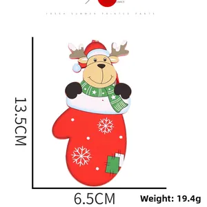 Detail of a red wooden reindeer glove Christmas ornament with snowflake and size marks