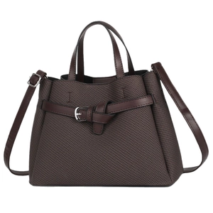 Brown textured tote bag with leather handles and silver buckle in a minimalist design